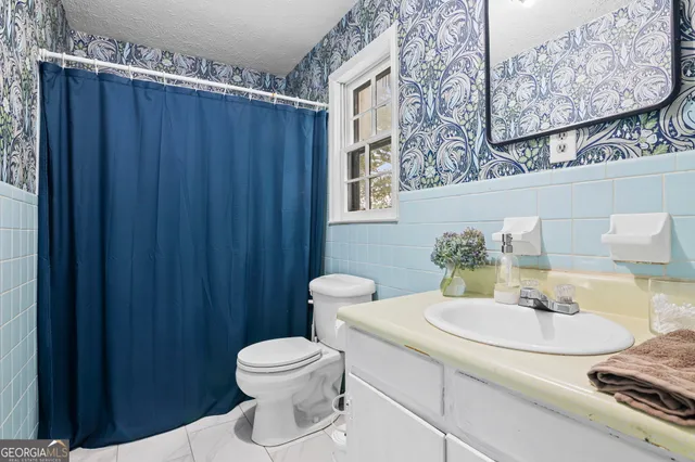 a view of grassy field with trees