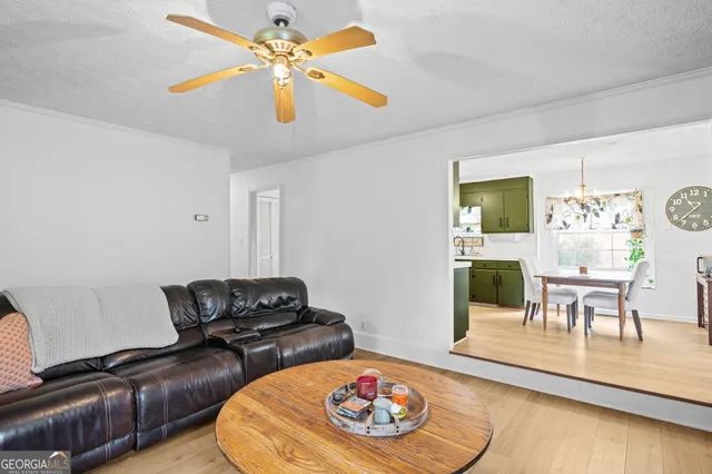 a bedroom with a large bed and a book shelf