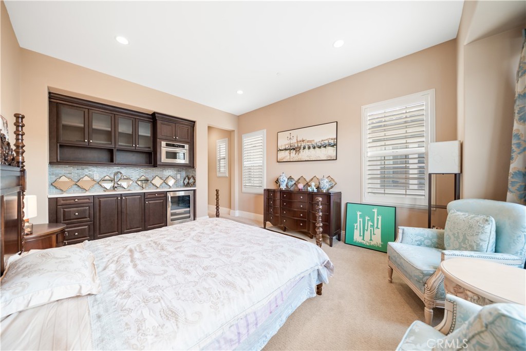 878 North Landa Way Brea, CA 92821 - Photo 18 of 52 a large bedroom with a bed and a view of kitchen