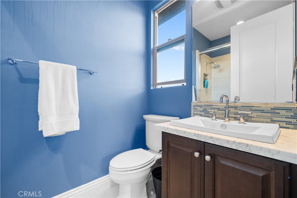 878 North Landa Way Brea, CA 92821 - Photo 38 of 52 a bathroom with a sink vanity mirror and toilet