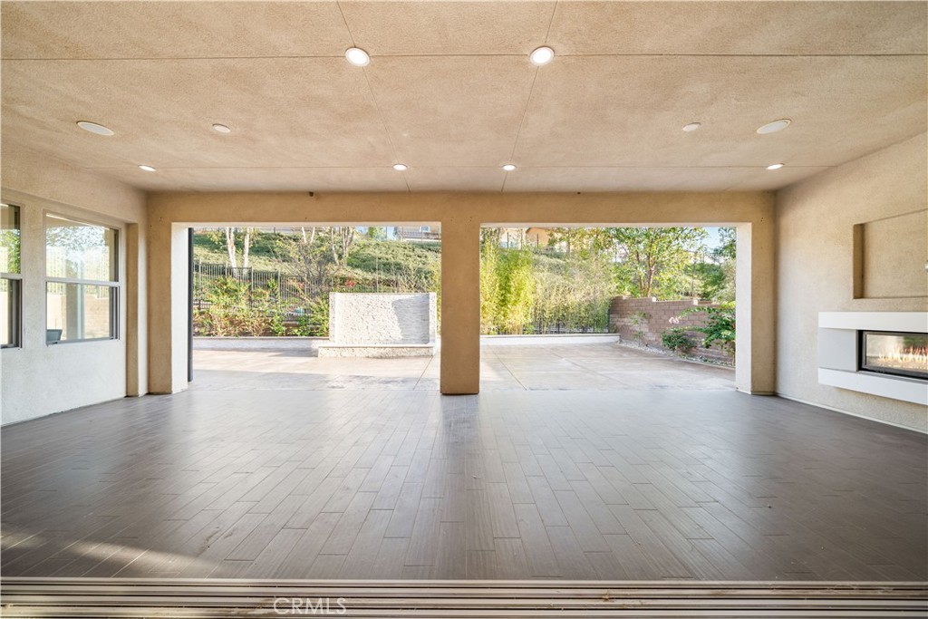 878 North Landa Way Brea, CA 92821 - Photo 43 of 52 an empty room with wooden floor and windows