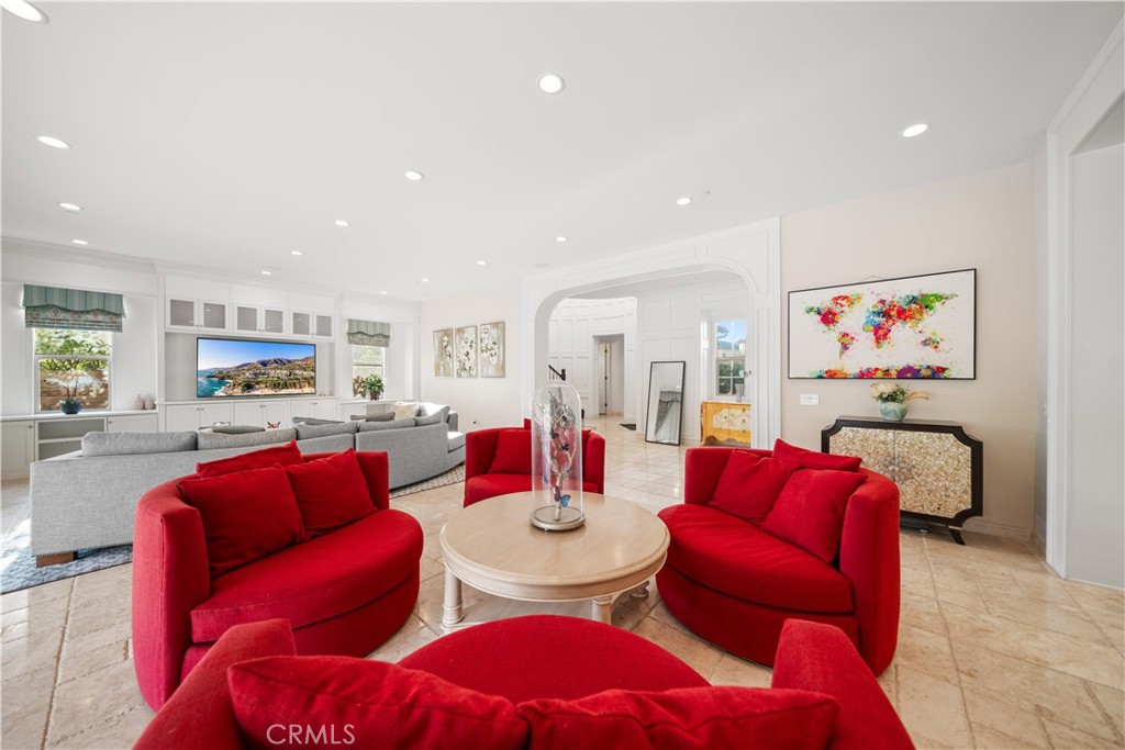 878 North Landa Way Brea, CA 92821 - Photo 10 of 52 a living room with furniture a red rug and kitchen view