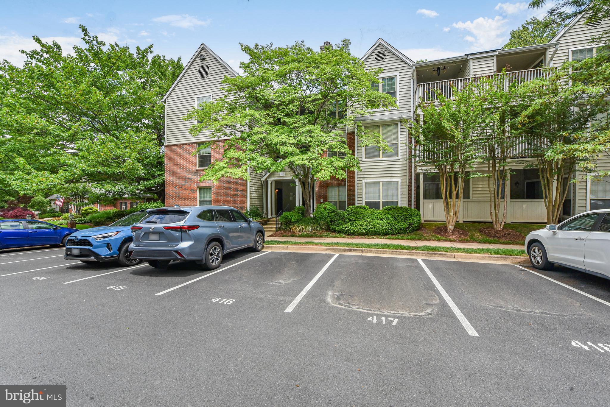 a view of a cars parked in front of a house
