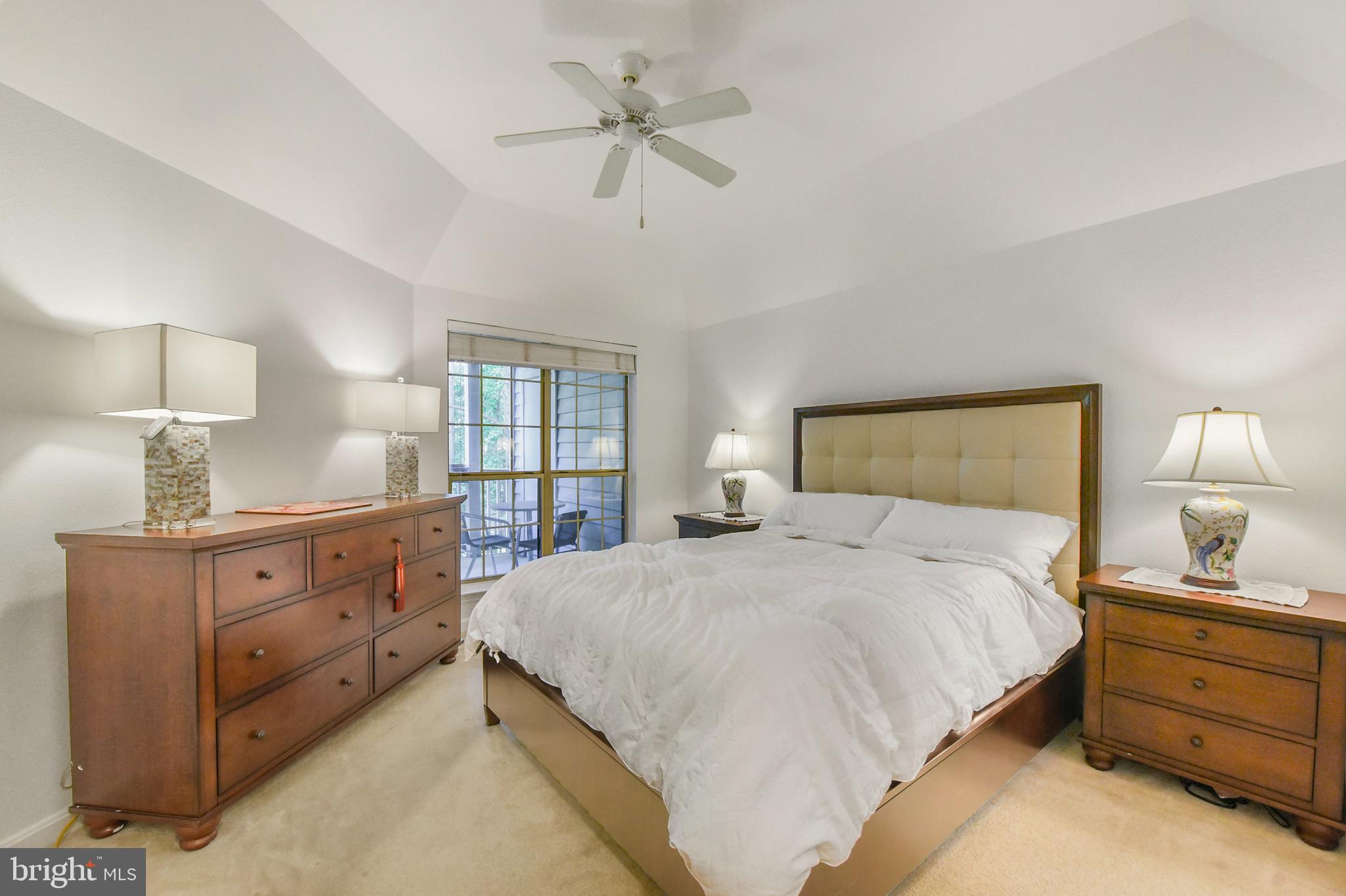 3909 Penderview Drive, Unit 1923 Fairfax, VA 22033 - Photo 11 of 19 a bedroom with a bed and a chandelier