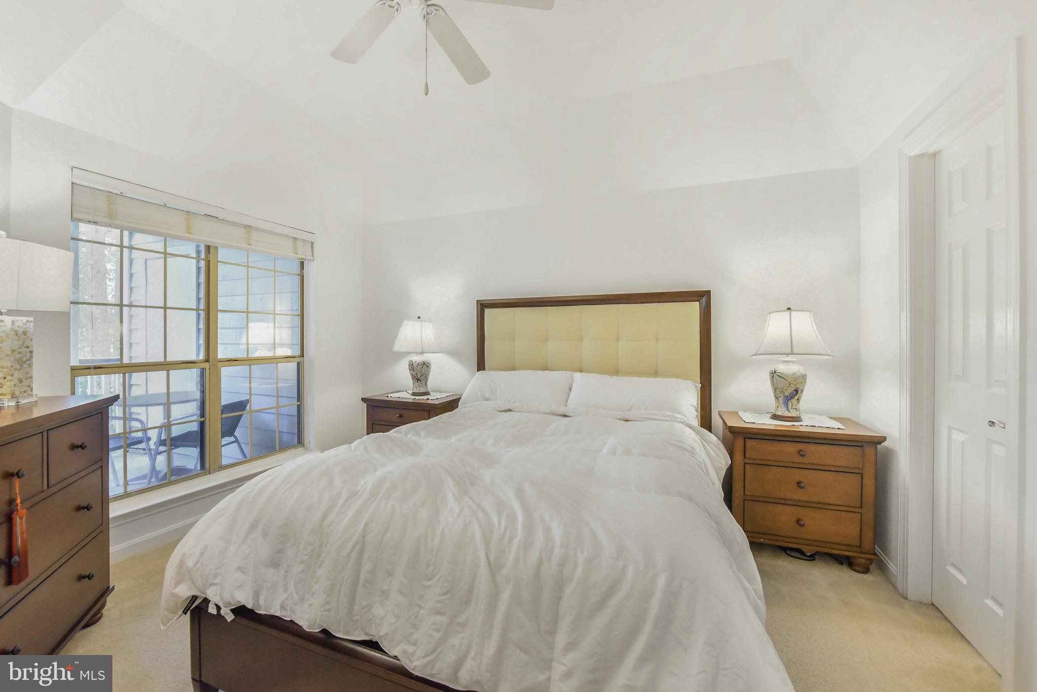 3909 Penderview Drive, Unit 1923 Fairfax, VA 22033 - Photo 12 of 19 a bedroom with a bed and wooden floor