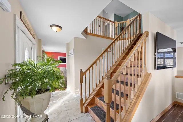 a view of entryway with wooden floor