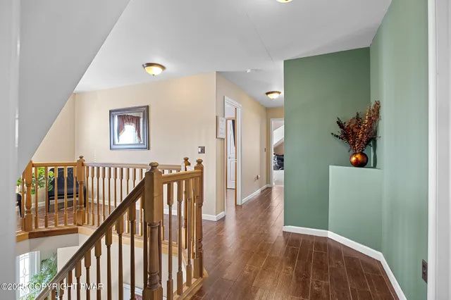 a view of entryway with wooden floor