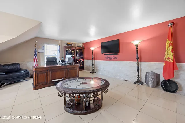 a kitchen with a sink a stove and chairs