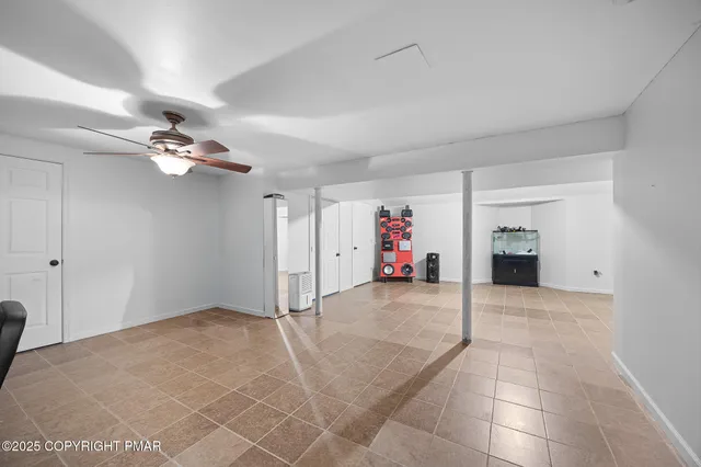 a view of livingroom with a ceiling fan and a rug