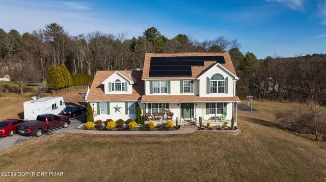 a view of a patio with a table chairs and a table