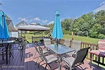 a view of a patio with a table and chairs
