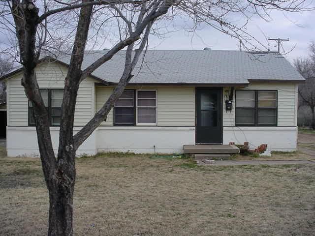 1719 Southwest 48th Avenue Amarillo, TX 79110 - Photo 1 of 1 a house with trees in the background