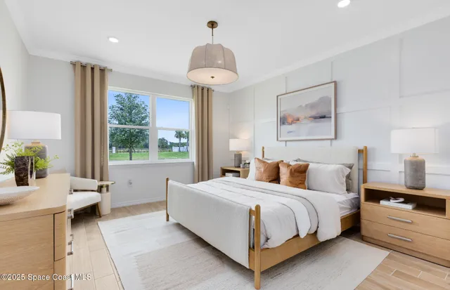 a living room with furniture and a painting