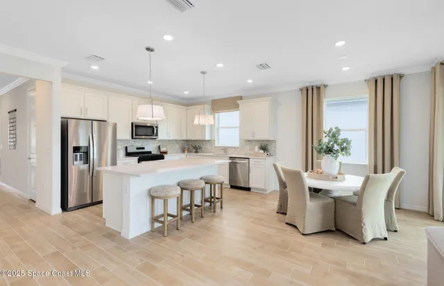 a view of a dining room with furniture window and outside view