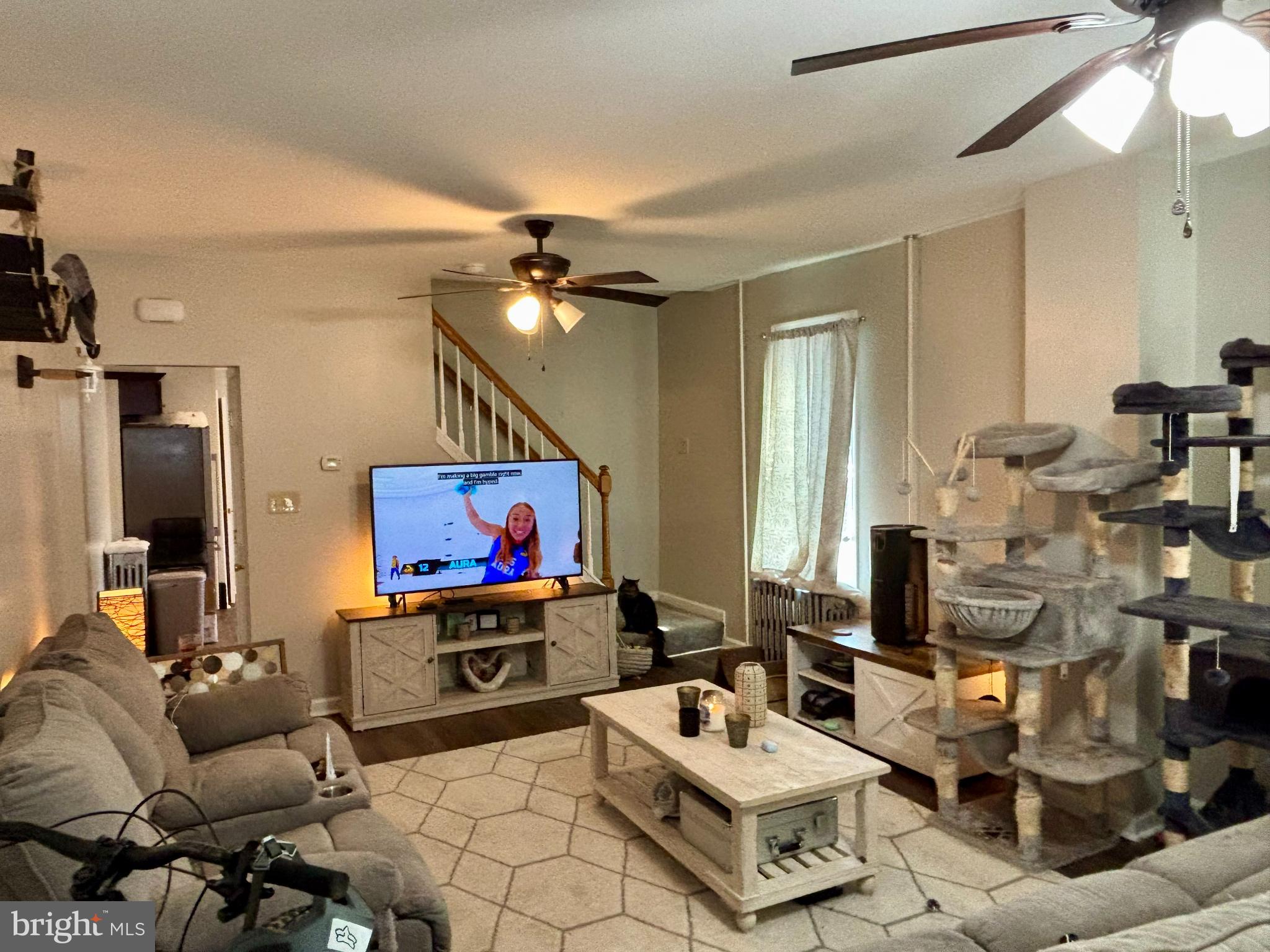 3 Grape Street Reading, PA 19611 - Photo 4 of 19 a living room with furniture and a flat screen tv