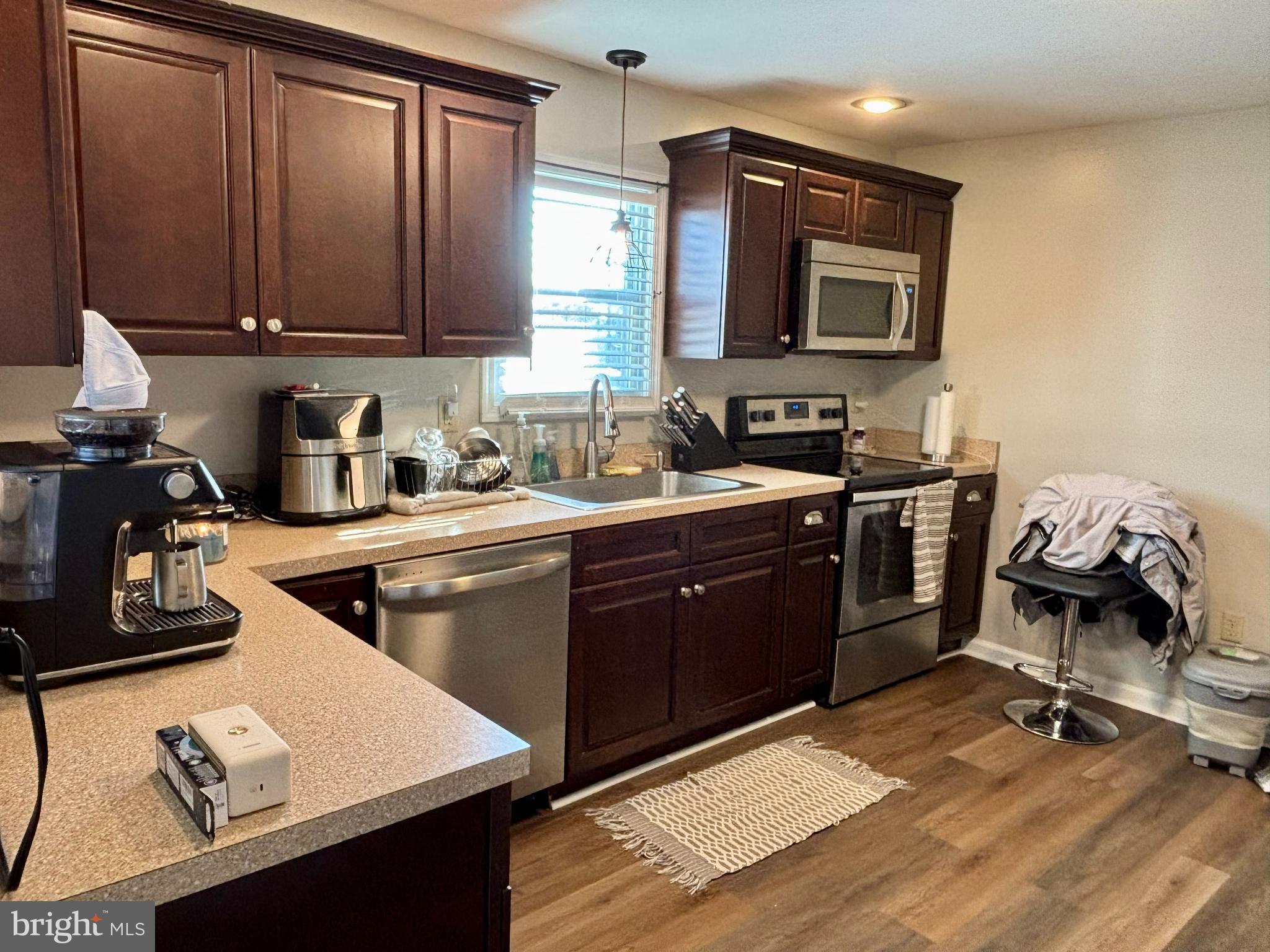 3 Grape Street Reading, PA 19611 - Photo 7 of 19 a kitchen with a sink stove and cabinets