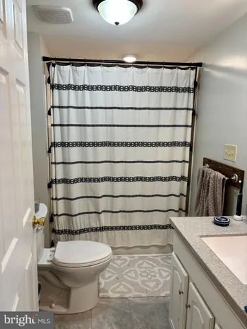 a bathroom with a sink and a shower