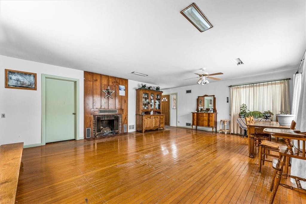 123 Mcelhaney Road Jamestown, PA 16134 - Photo 7 of 30 a living room with fireplace furniture and a wooden floor