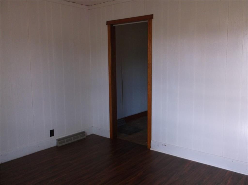 1333 Sugar Hollow Road Apollo, PA 15613 - Photo 11 of 25 an empty room with wooden floor