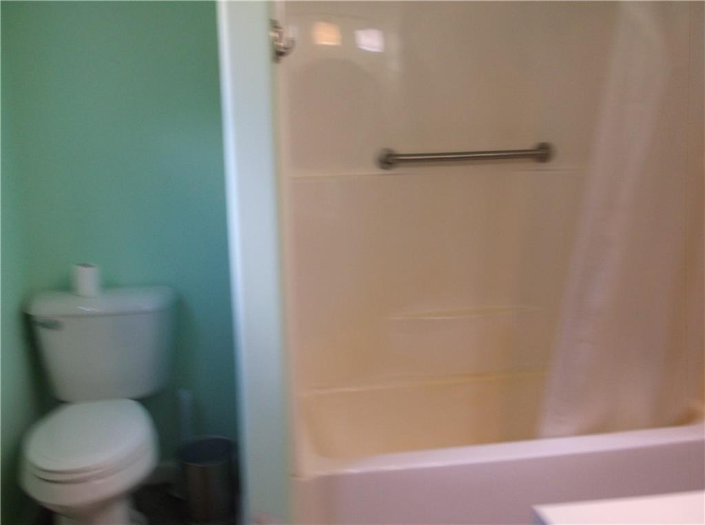 1333 Sugar Hollow Road Apollo, PA 15613 - Photo 20 of 25 a white toilet sitting next to a shower