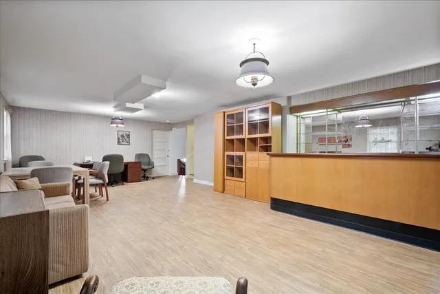 a living room with furniture window and wooden floor