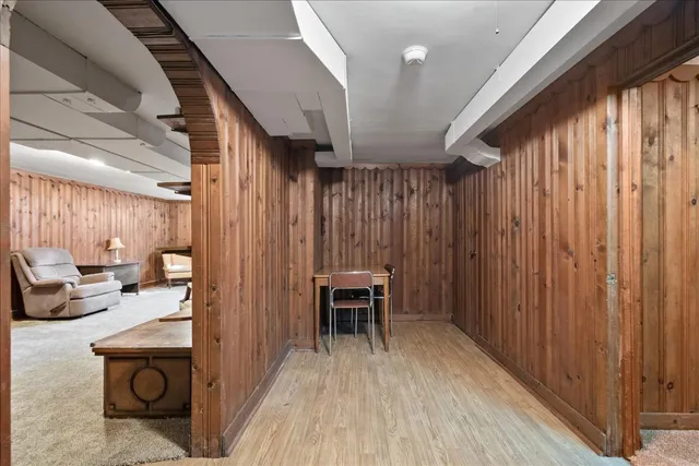 a view of a hallway with seating area