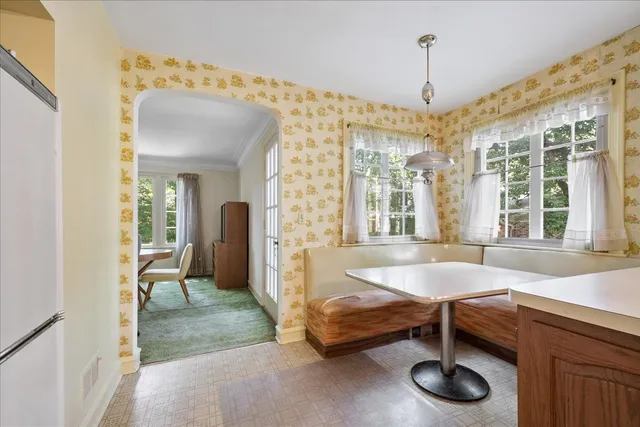 a living room with furniture and a table