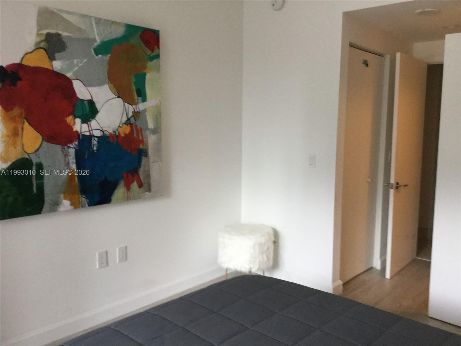 55 Southwest 9th Street, Unit 1905 Miami, FL 33130 - Photo 11 of 19 a view of hallway with cabinets and a potted plant