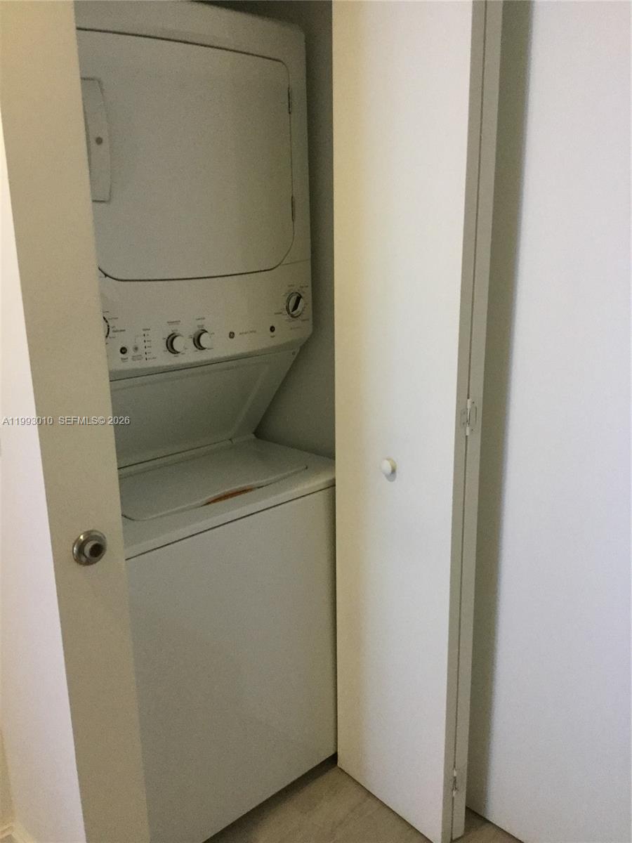 55 Southwest 9th Street, Unit 1905 Miami, FL 33130 - Photo 15 of 19 a utility room with dryer and washer