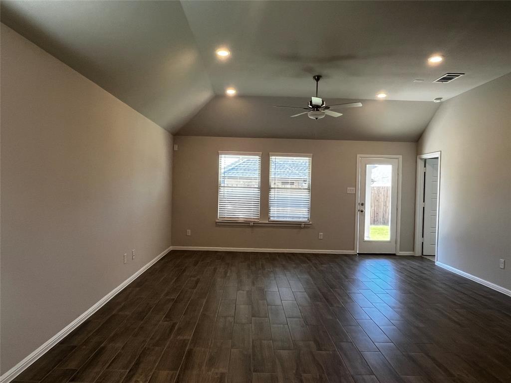 409 Wydown Drive Princeton, TX 75407 - Photo 18 of 29 an empty room with wooden floor and windows