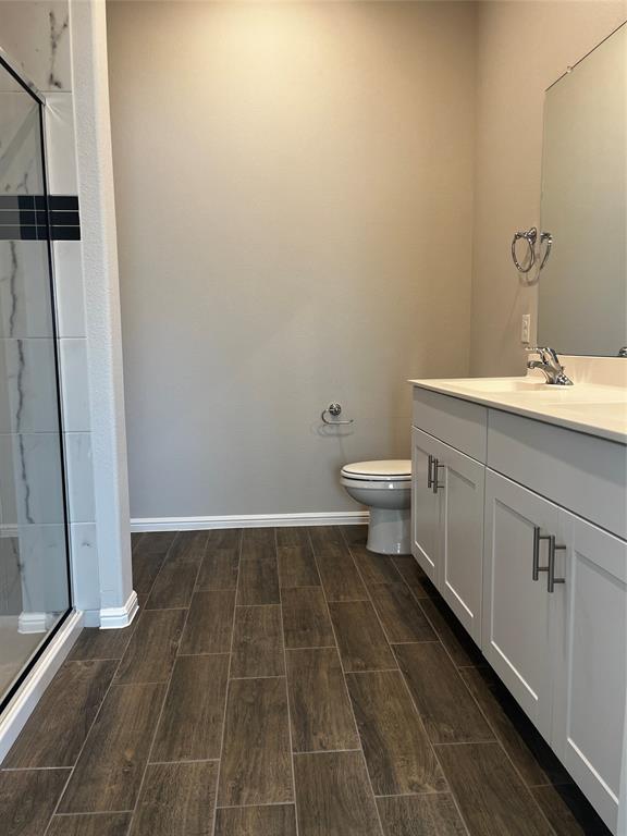 409 Wydown Drive Princeton, TX 75407 - Photo 24 of 29 a bathroom with a sink and a toilet