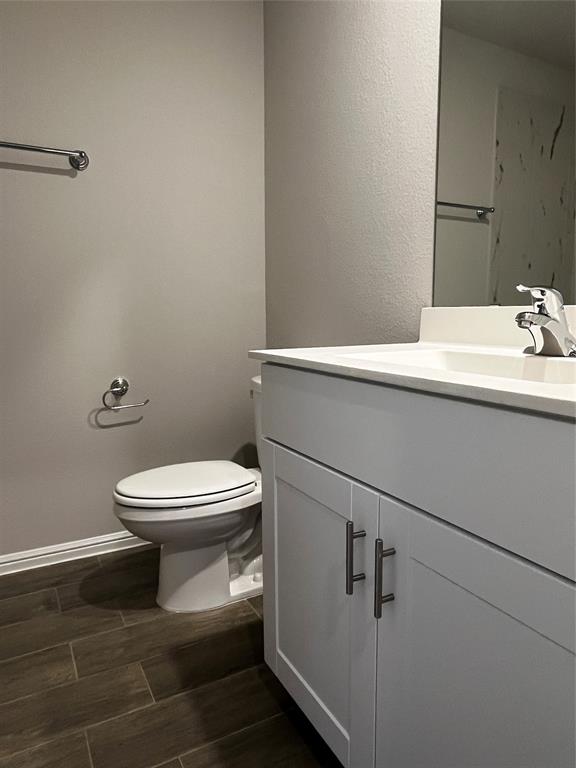 409 Wydown Drive Princeton, TX 75407 - Photo 5 of 29 a bathroom with a toilet and a sink