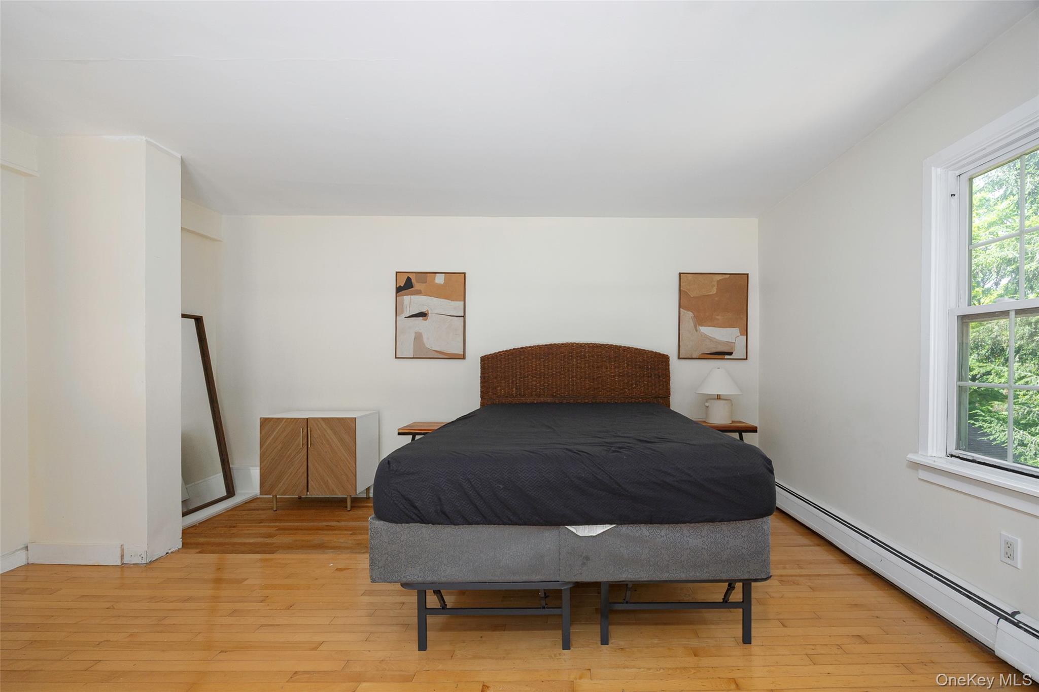 83-85 Old Post Road Staatsburg, NY 12580 - Photo 17 of 36 a bedroom with a bed and wooden floor