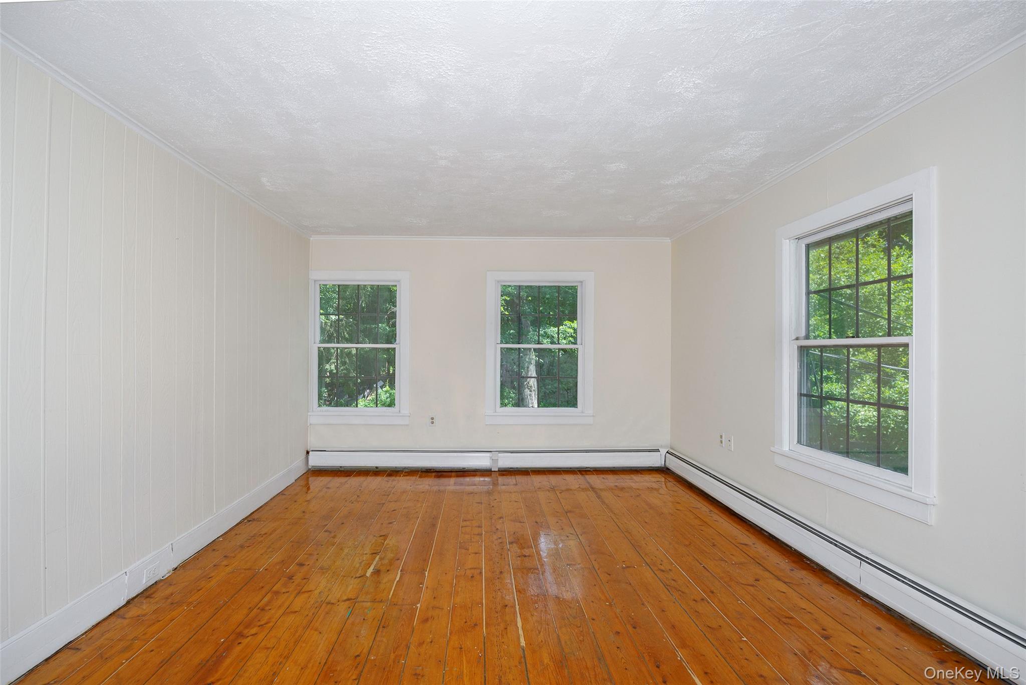 83-85 Old Post Road Staatsburg, NY 12580 - Photo 21 of 36 an empty room with wooden floor and windows