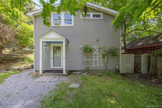 a view of a house with a yard and garage