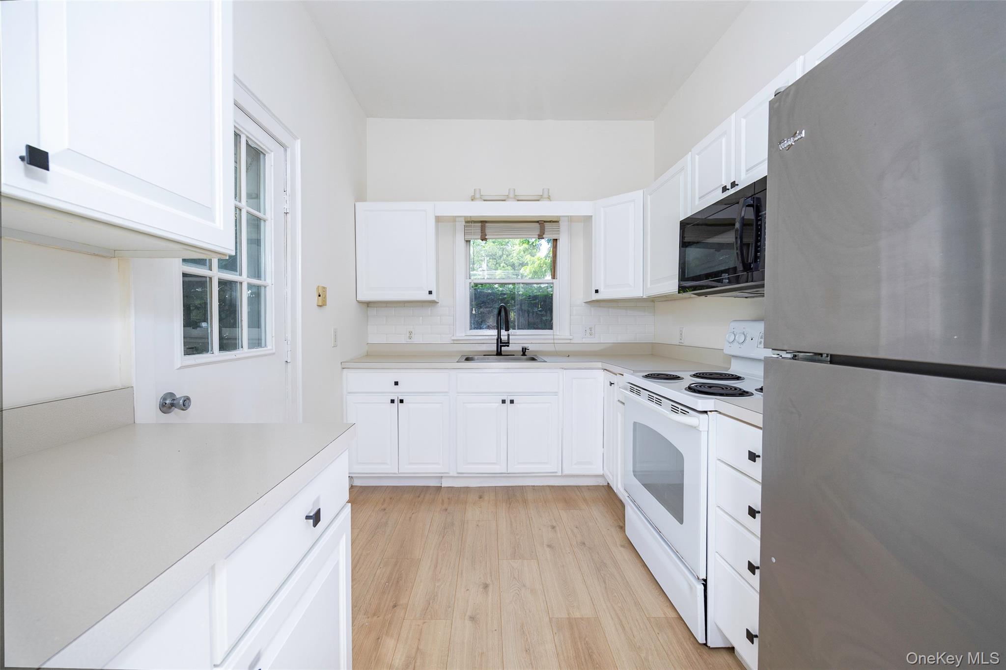 83-85 Old Post Road Staatsburg, NY 12580 - Photo 28 of 36 a kitchen with granite countertop a sink appliances cabinets and a counter top space
