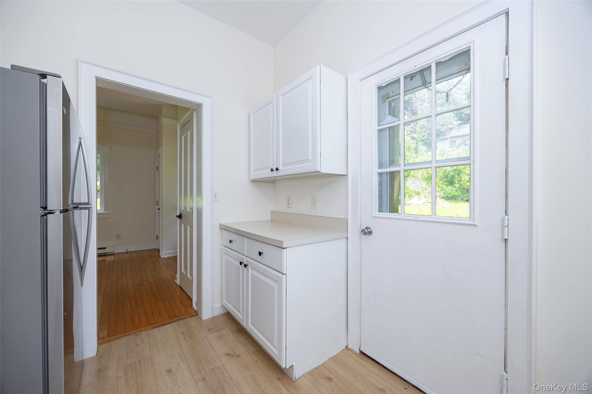 83-85 Old Post Road Staatsburg, NY 12580 - Photo 29 of 36 a kitchen with white cabinets and window