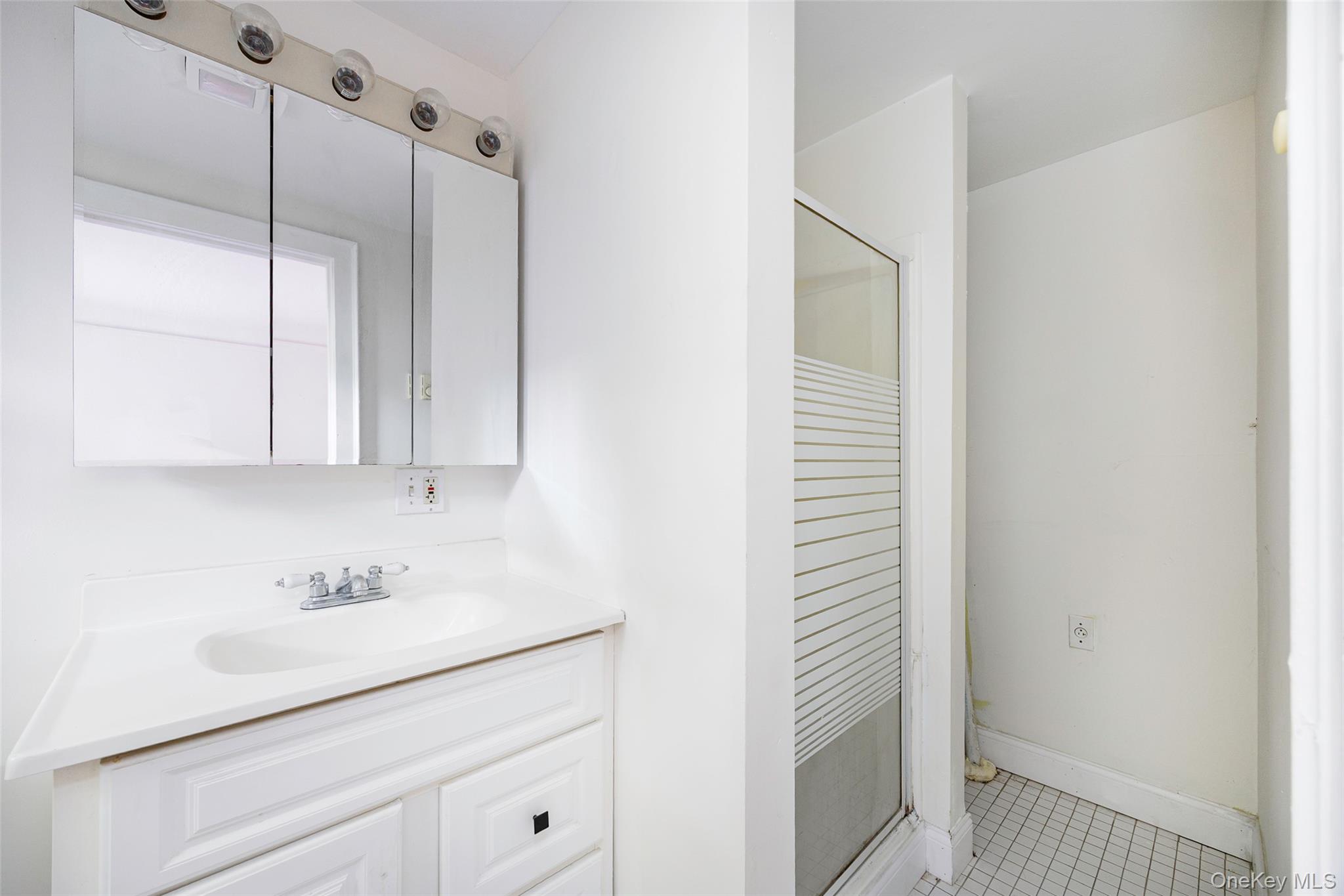 83-85 Old Post Road Staatsburg, NY 12580 - Photo 32 of 36 a bathroom with a sink and a mirror