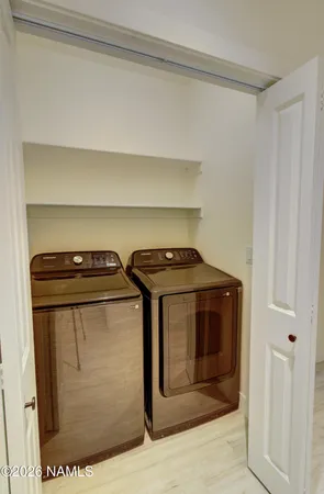 a utility room with washer and dryer