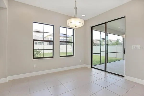 a view of a dining room with furniture and window