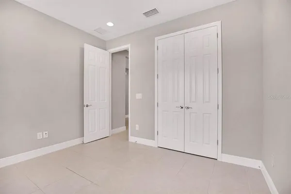 a bathroom with a granite countertop sink a toilet and bathtub