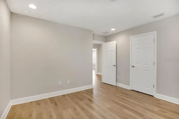 a bathroom with a granite countertop sink and a window