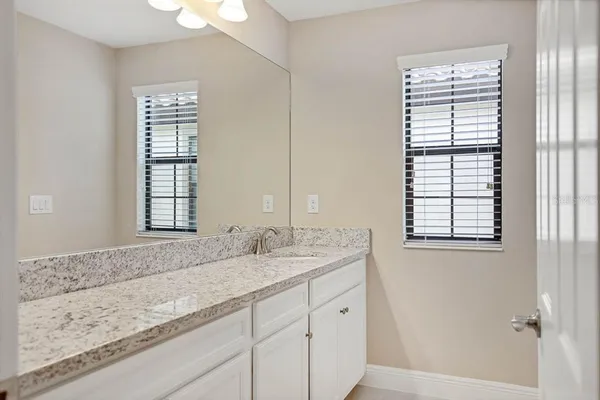 a view of an empty room with a floor to ceiling window