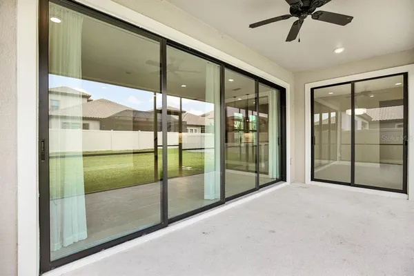 a view of a yard with a house in the background