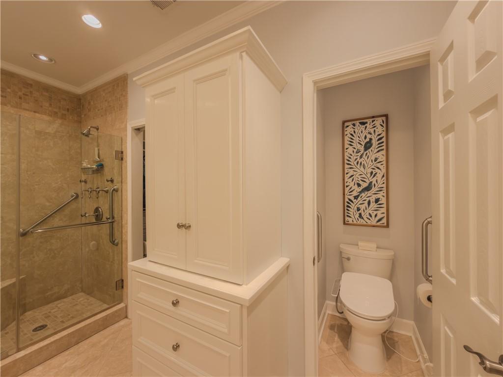 4284 Cedar Bluff Way Southwest Lilburn, GA 30047 - Photo 14 of 62 a bathroom with a shower and toilet