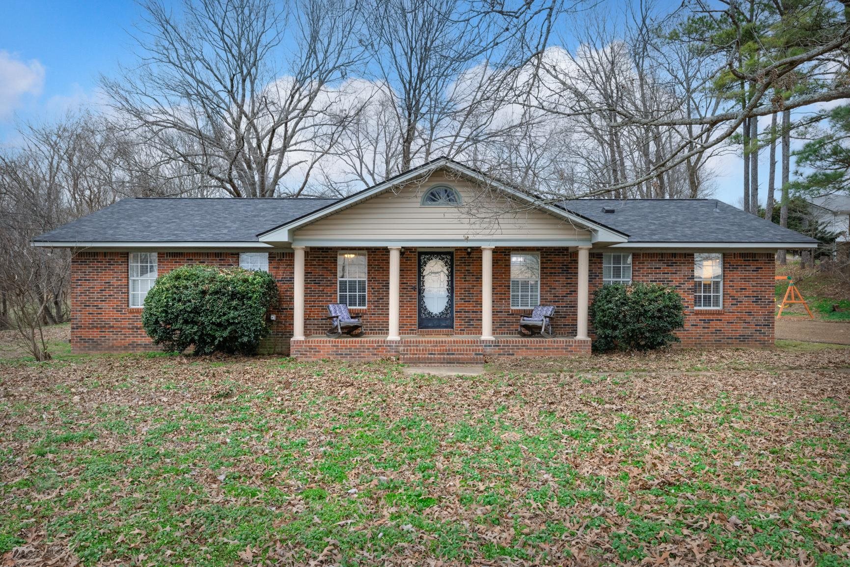 9472 Highway 59 Burlison, TN 38015 - Photo 4 of 34 a front view of a house with a yard