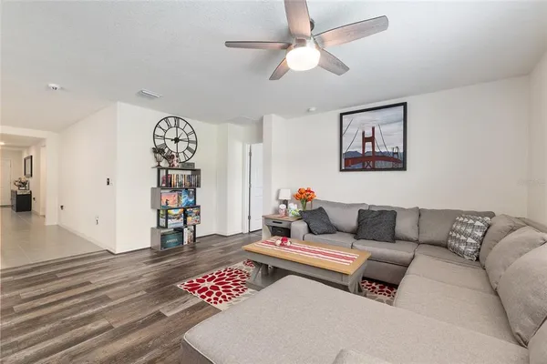 a kitchen with stainless steel appliances granite countertop a sink stove and white cabinets