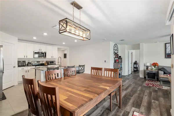 a bathroom with a double vanity sink mirror and shower