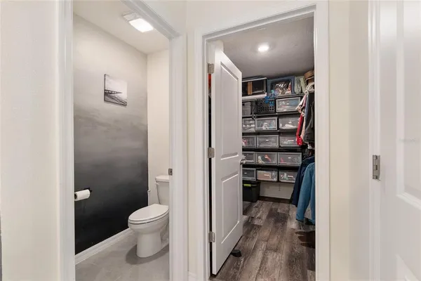 a bedroom with furniture and a book shelf
