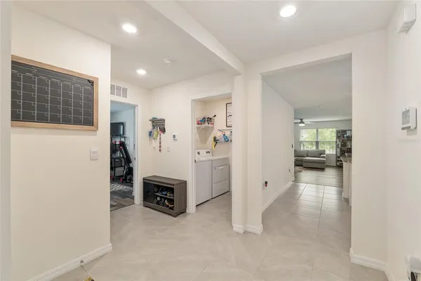 a view of a backyard with a garden and entertaining space